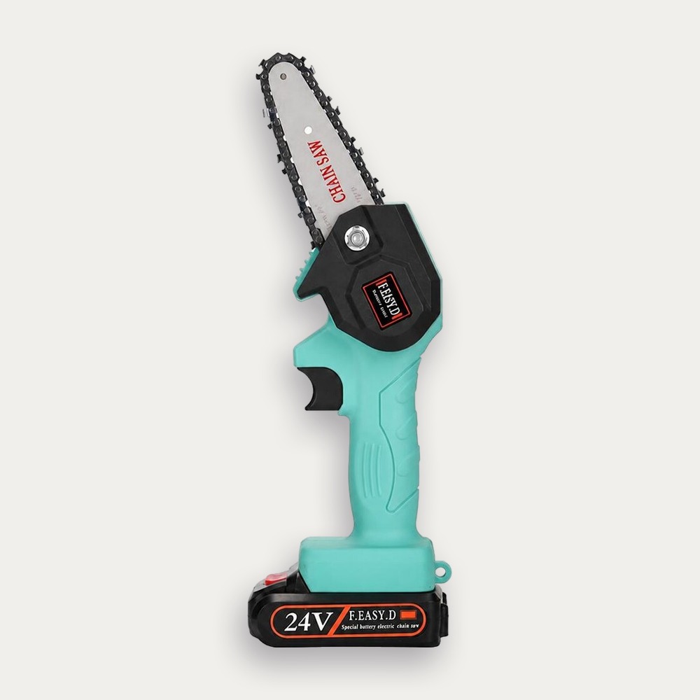 Une mini scie électrique rechargeable turquoise et noire, avec une petite lame, posée sur fond blanc.
